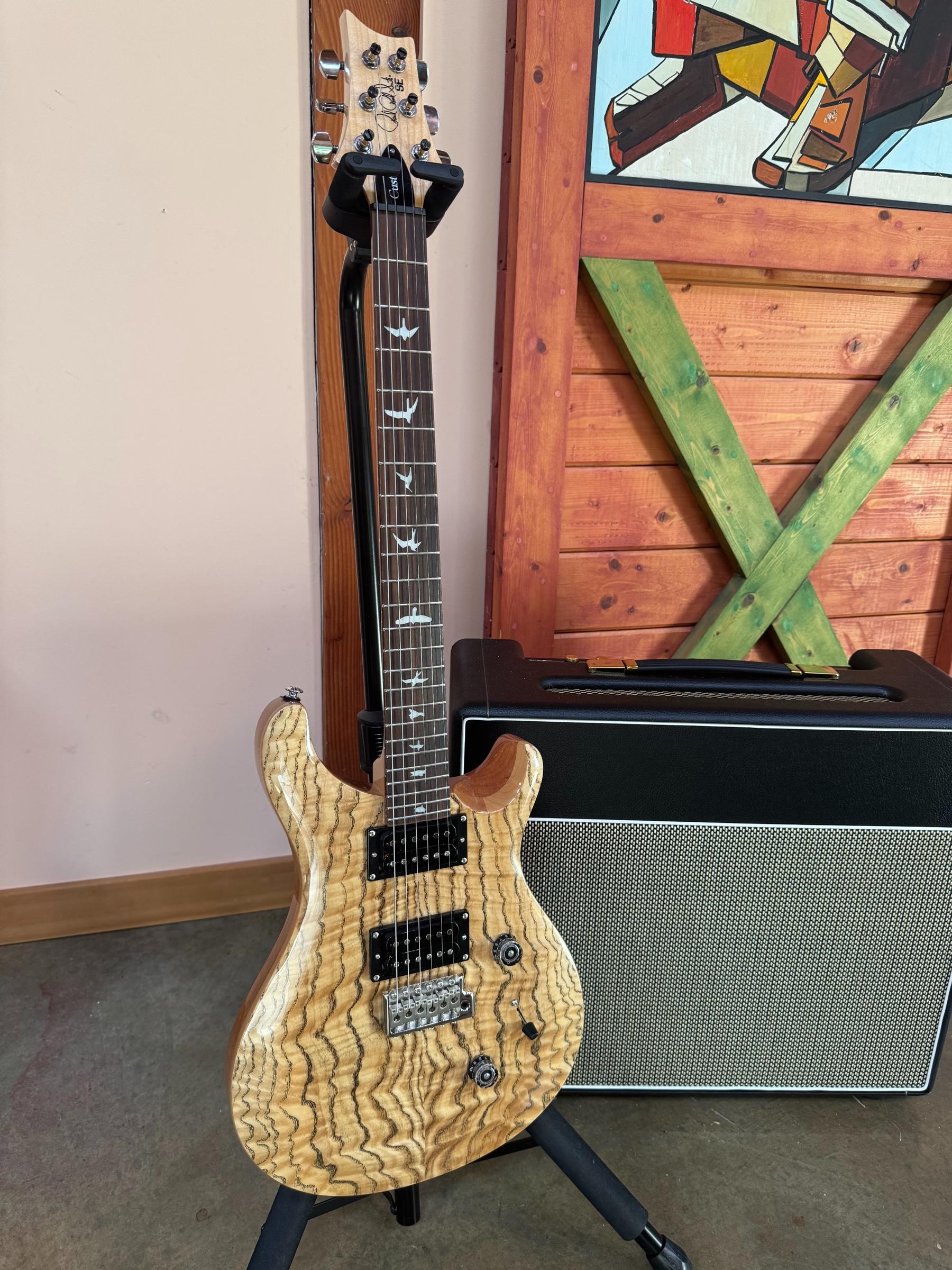 Natural-finish PRS SE Custom 24 Burled Ash reference guitar, full front view