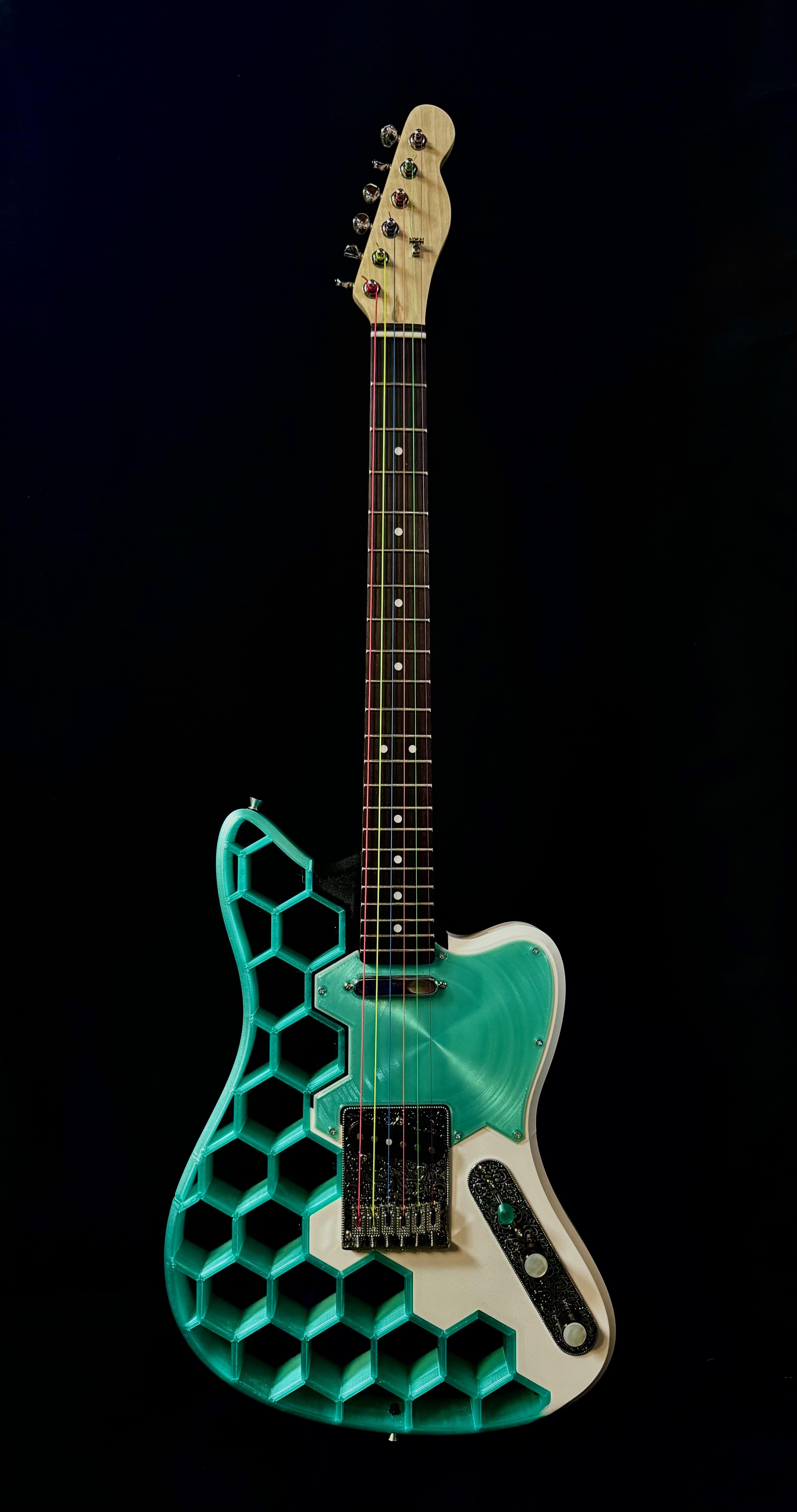 Telecaster-style guitar with rainbow strings, front view